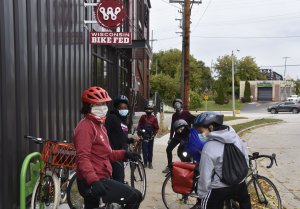 Children stand with bikes outside Wisconsin Bike Fed building.