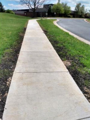 new sidewalk built connecting school to nearby neighborhood