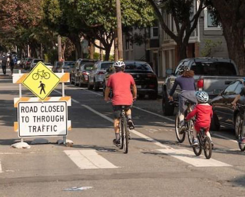 cyclists using a road that is closed to through traffic 